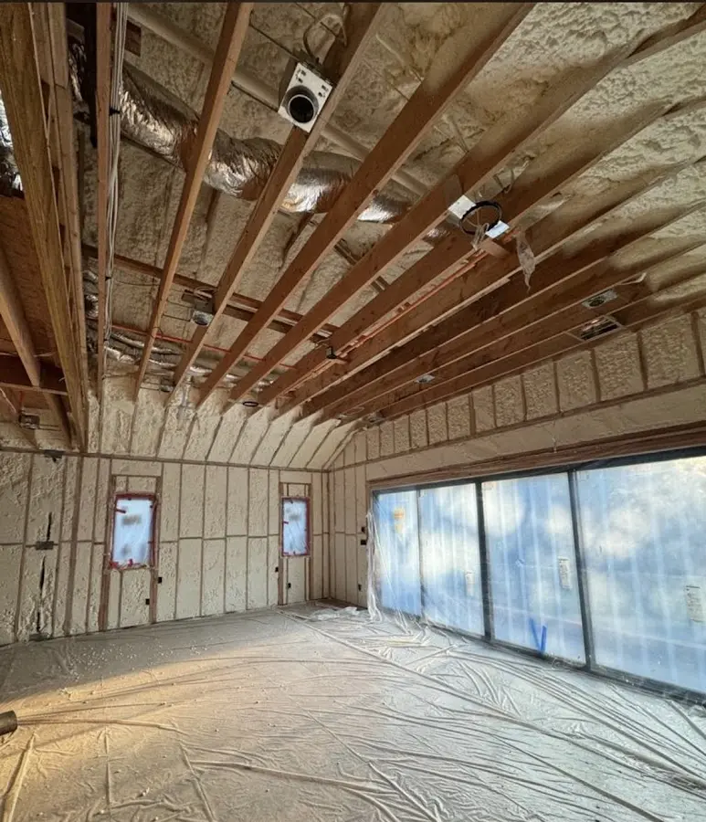 Interior walls and ceiling insulated with spray foam during new construction in Flowery Branch